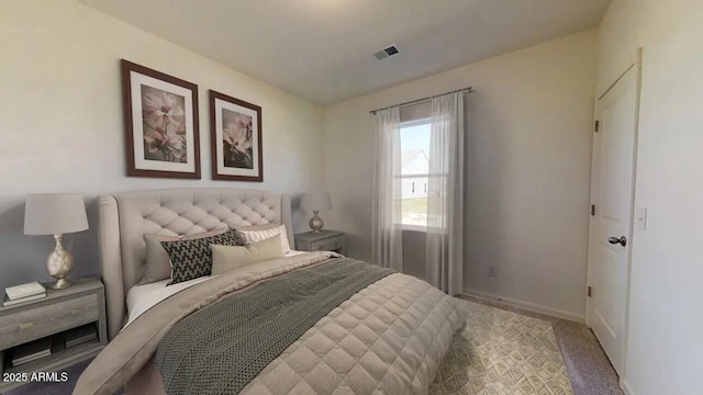 bedroom with visible vents, baseboards, and carpet