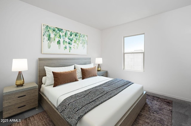 bedroom with dark colored carpet and baseboards