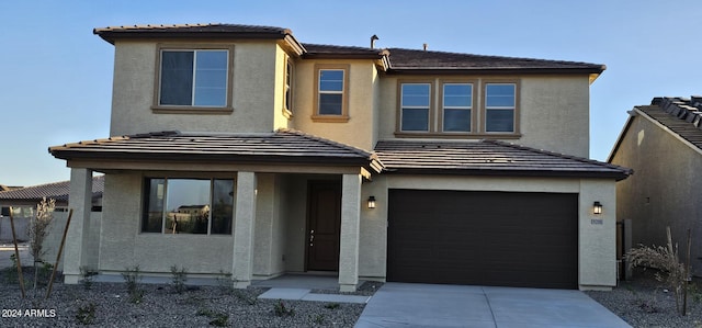 view of front of home featuring a garage and covered porch