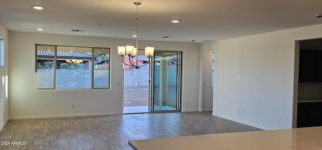 unfurnished room with wood-type flooring