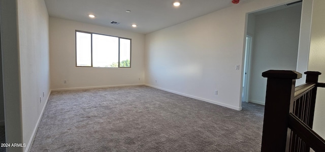 empty room with light colored carpet
