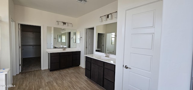 bathroom with vanity and hardwood / wood-style flooring