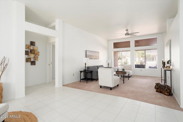 carpeted living room featuring ceiling fan