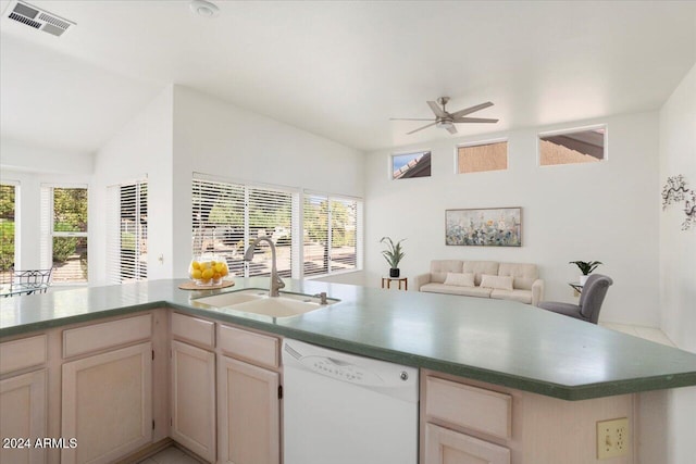 kitchen featuring plenty of natural light, sink, white dishwasher, and ceiling fan