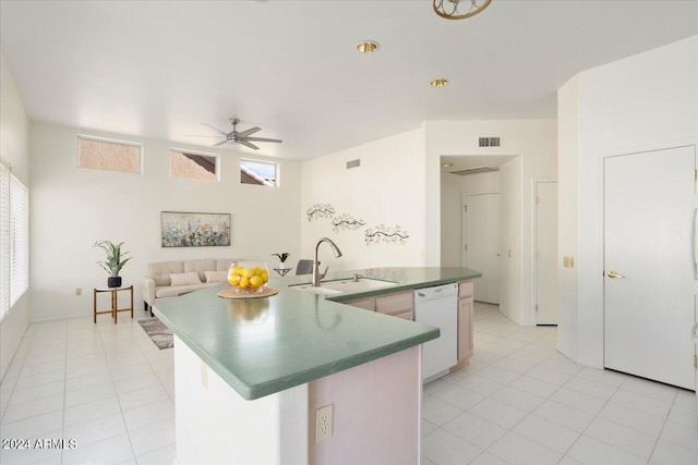 kitchen with light tile patterned floors, sink, an island with sink, dishwasher, and ceiling fan