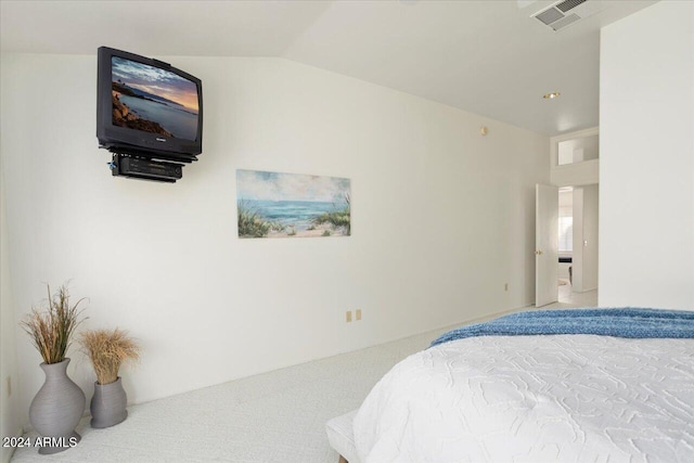 carpeted bedroom featuring lofted ceiling