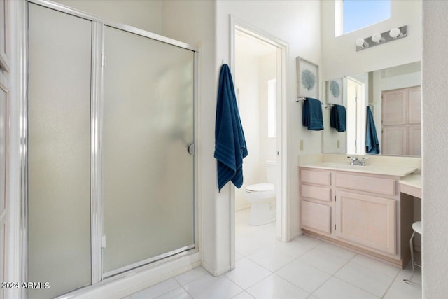 bathroom with toilet, vanity, an enclosed shower, and tile patterned floors