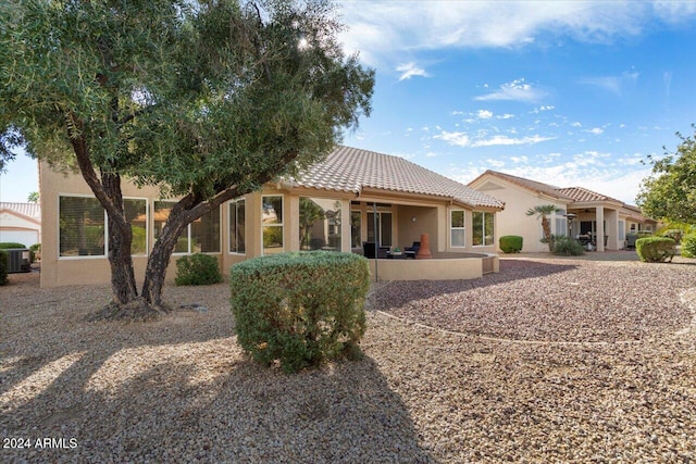 back of property featuring a patio