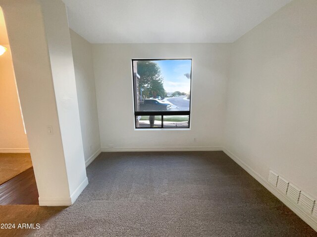 spare room featuring dark hardwood / wood-style floors