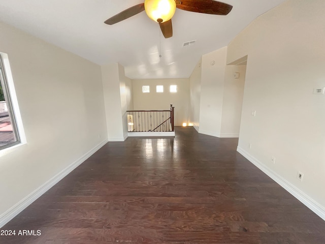 unfurnished room with ceiling fan and dark hardwood / wood-style floors