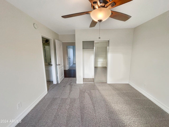 unfurnished bedroom with ceiling fan, light carpet, and a closet