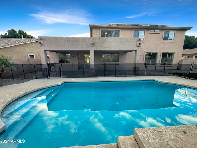 view of swimming pool featuring a patio area