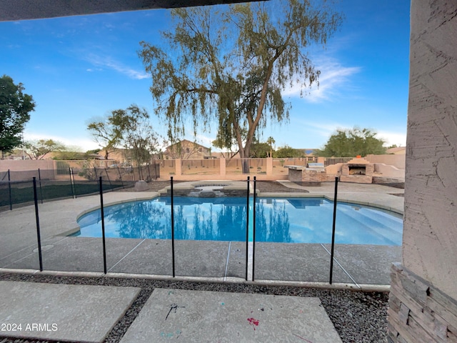 view of swimming pool featuring a patio area