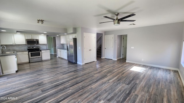 kitchen featuring dark wood-type flooring, sink, ceiling fan, white cabinetry, and appliances with stainless steel finishes