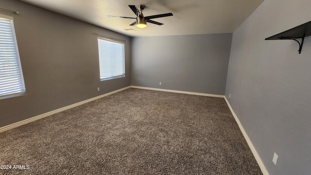 spare room featuring carpet flooring and ceiling fan