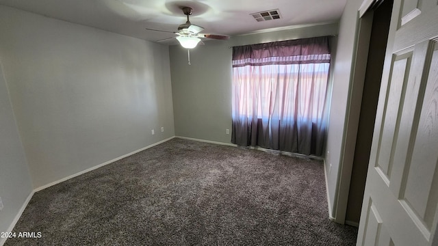 spare room with ceiling fan and carpet flooring