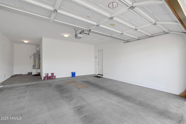 garage with a garage door opener and water heater