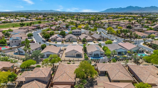 birds eye view of property with a residential view and a mountain view