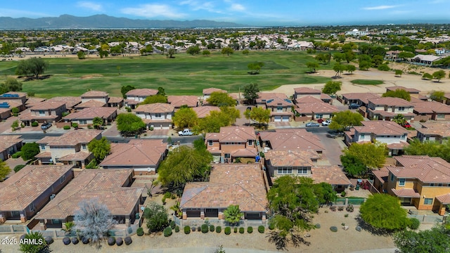 drone / aerial view featuring a mountain view, a residential view, and golf course view