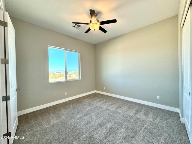 unfurnished room featuring carpet floors and ceiling fan