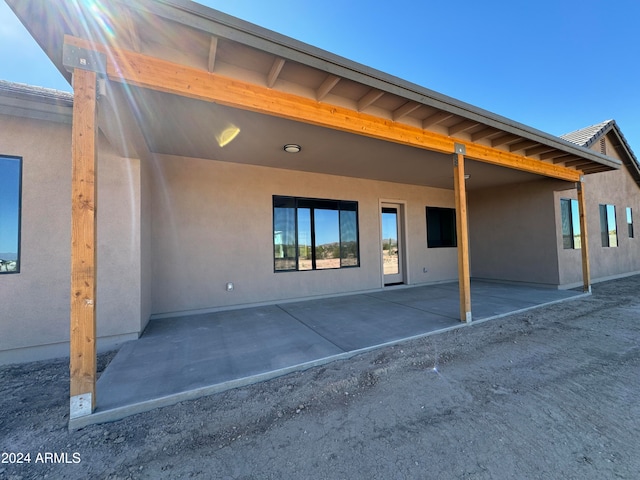 rear view of house featuring a patio area