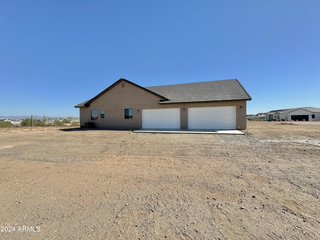 exterior space with a garage