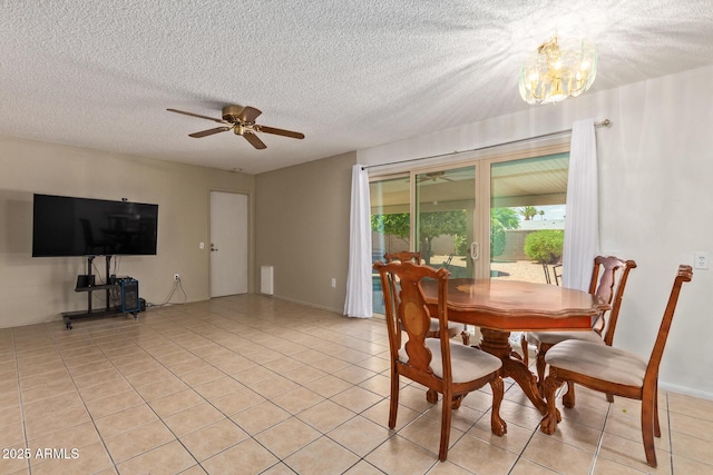 dining area featuring a textured ceiling, light tile patterned flooring, and ceiling fan with notable chandelier