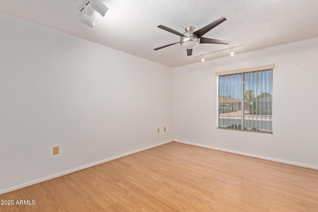 unfurnished room featuring a textured ceiling, ceiling fan, light hardwood / wood-style flooring, and track lighting