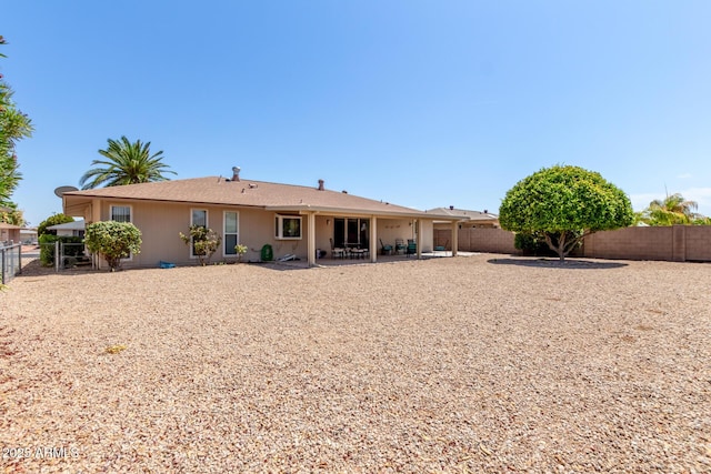 rear view of house featuring a patio