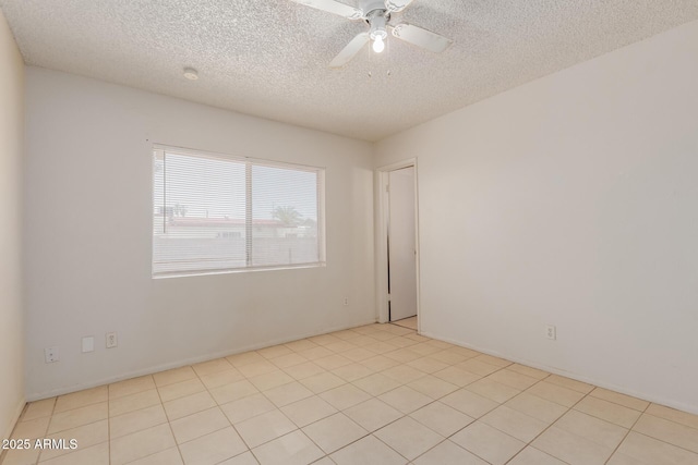 5933 W Mitchell Dr, Phoenix, AZ 85033 - unfurnished room with a textured ceiling and a ceiling fan