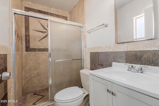 5933 W Mitchell Dr, Phoenix, AZ 85033 - full bath with vanity, a stall shower, tile walls, and wainscoting