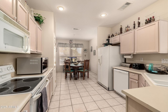 15874 W Wildflower Dr, Surprise, AZ 85374 - kitchen with white appliances, light countertops, light tile patterned floors, decorative light fixtures, and recessed lighting