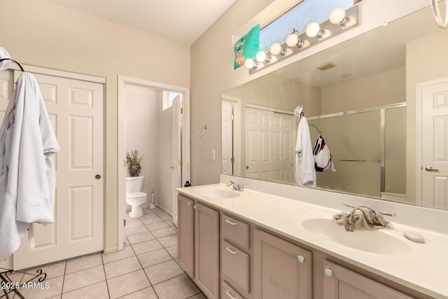 15874 W Wildflower Dr, Surprise, AZ 85374 - full bath featuring tile patterned flooring, double vanity, and an enclosed shower