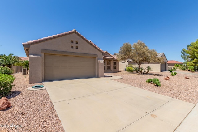 15874 W Wildflower Dr, Surprise, AZ 85374 - view of front of house with stucco siding, concrete driveway, and a tiled roof