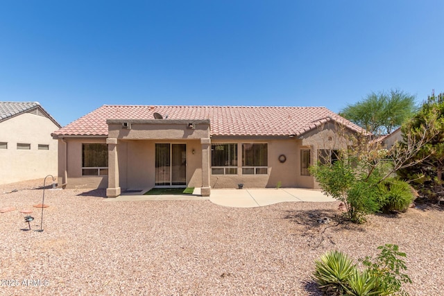 15874 W Wildflower Dr, Surprise, AZ 85374 - rear view of house with stucco siding, a tiled roof, and a patio
