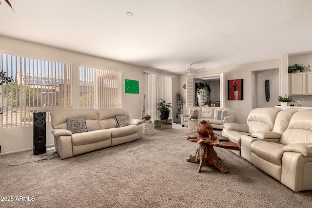 15874 W Wildflower Dr, Surprise, AZ 85374 - carpeted living room with a ceiling fan