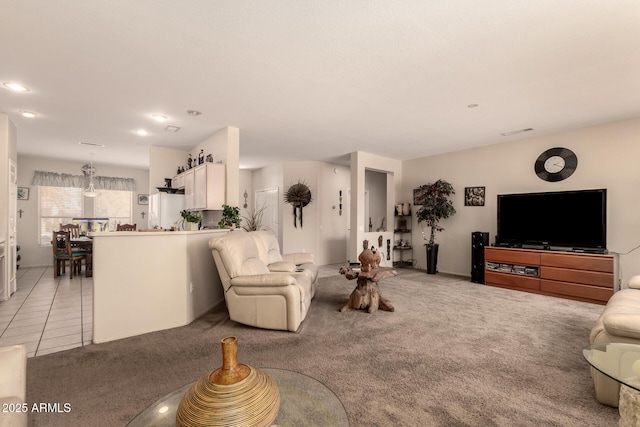 15874 W Wildflower Dr, Surprise, AZ 85374 - living room featuring light carpet, recessed lighting, and light tile patterned floors