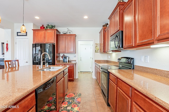 kitchen featuring sink, hanging light fixtures, light tile patterned floors, black appliances, and light stone countertops