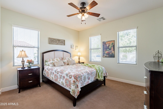 bedroom with light carpet and ceiling fan