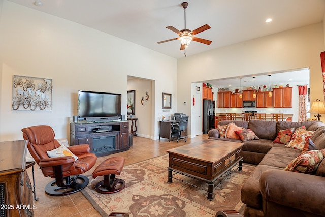 tiled living room with ceiling fan