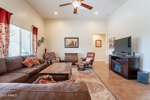 living room featuring ceiling fan and light tile patterned flooring