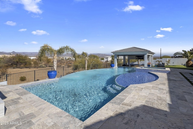 view of swimming pool featuring a gazebo and a patio