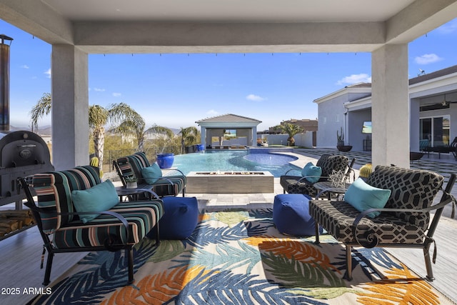 view of pool featuring area for grilling, a patio area, and pool water feature