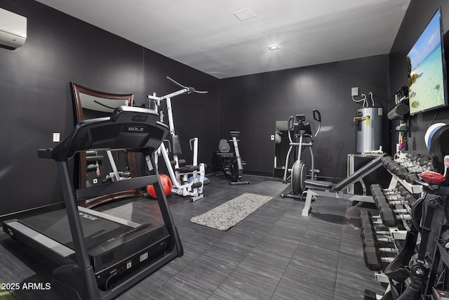 exercise room with a wall mounted AC and electric water heater