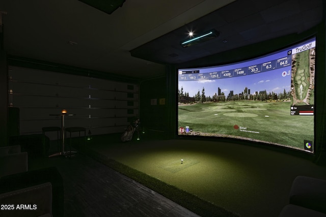 recreation room with golf simulator and hardwood / wood-style flooring