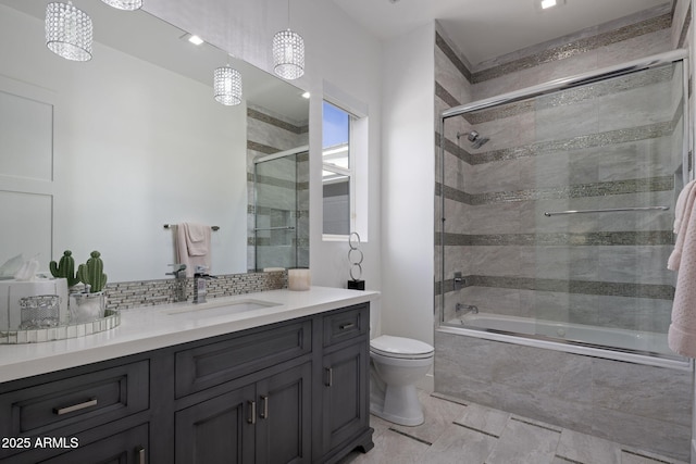 full bathroom with enclosed tub / shower combo, vanity, toilet, and decorative backsplash