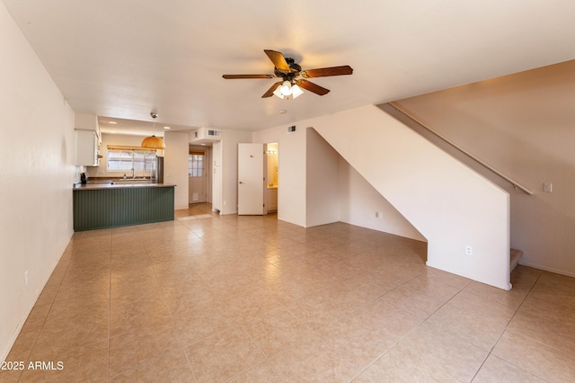 860 N Mcqueen Rd Unit 1151, Chandler, AZ 85225 - unfurnished living room featuring ceiling fan, stairway, and light tile patterned flooring