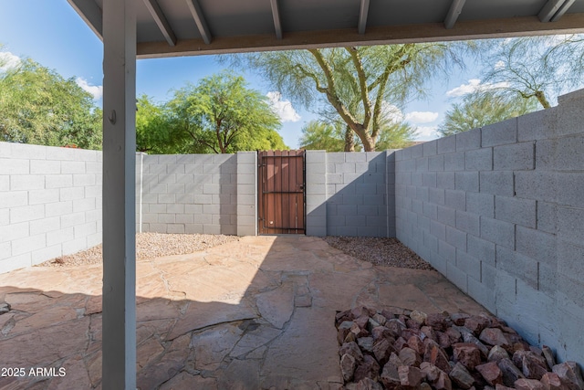 860 N Mcqueen Rd Unit 1151, Chandler, AZ 85225 - fenced backyard with a gate and a patio