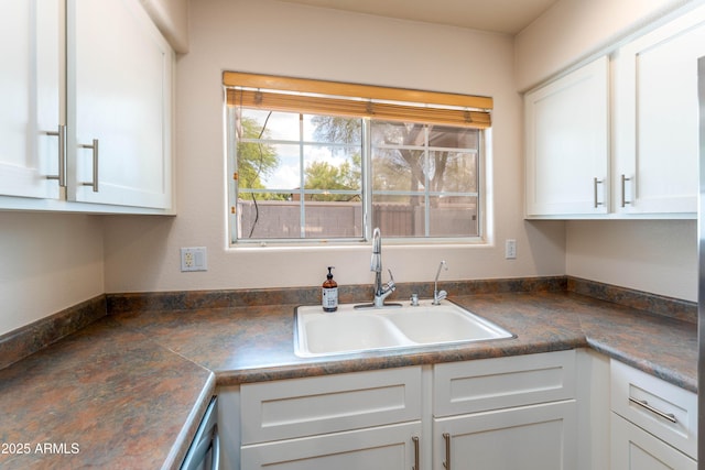 860 N Mcqueen Rd Unit 1151, Chandler, AZ 85225 - kitchen with dark countertops, white cabinets, and stainless steel dishwasher