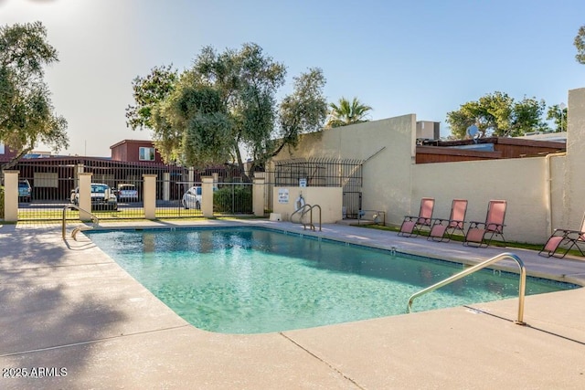 view of pool featuring a patio area